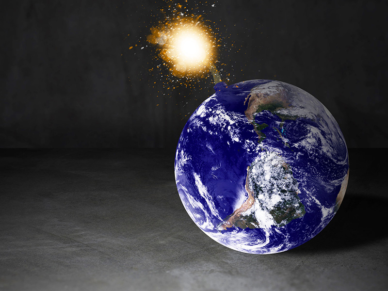 Planète terre prenant la forme d'une bombe.